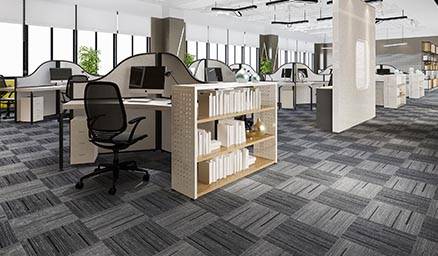 Modern office interior with desks, chairs, and bookshelf