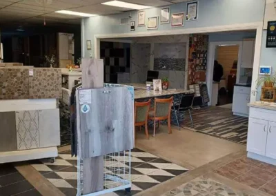 Interior of a tile showroom with various floor and wall tile displays