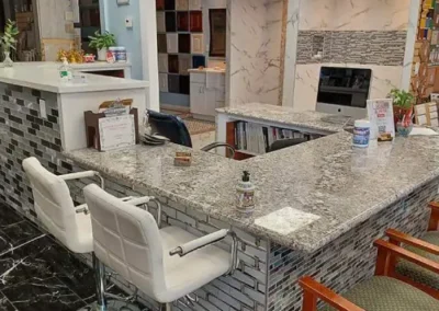 modern office reception area with a marble desk, white chairs, and stylish interior design elements